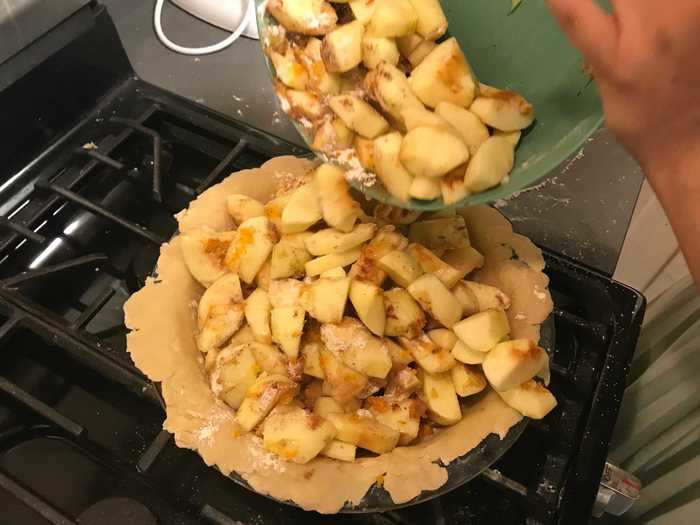 Add the apple filling on top of the bottom crust and then cover.