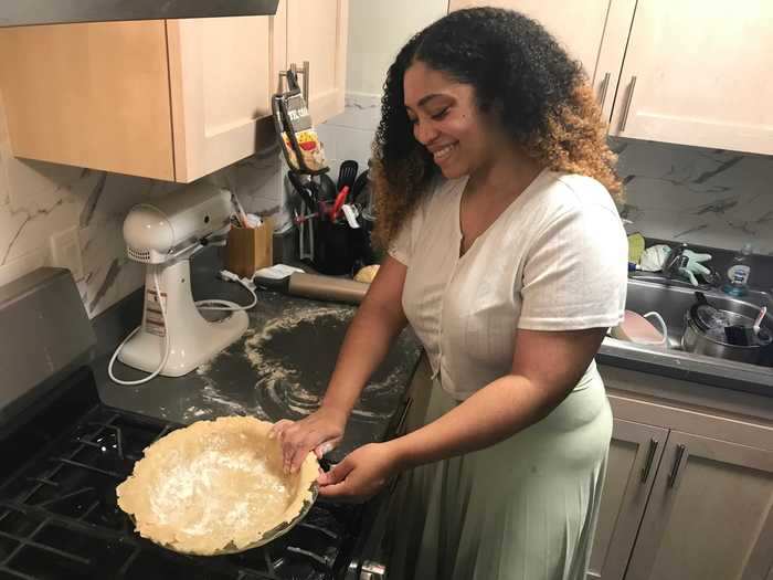 Next, I cut the dough ball into two halves and rolled each into a large circle for the pie pan.