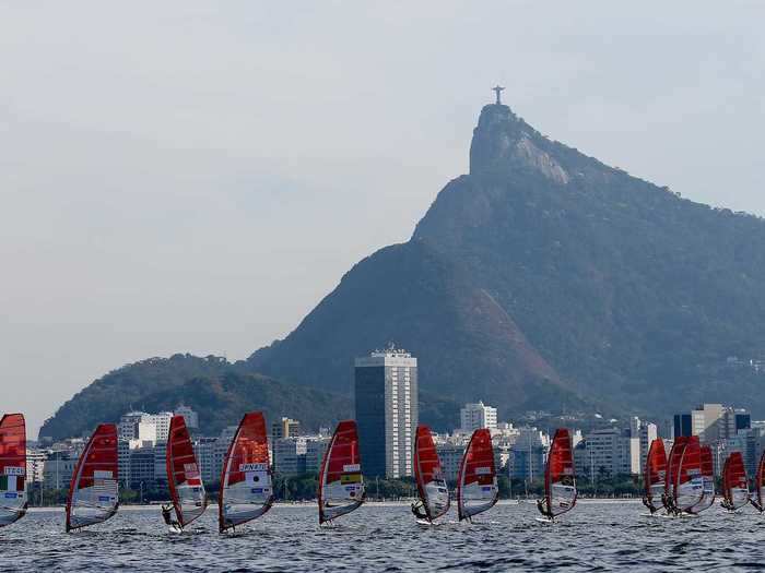 Christ the Redeemer looks down upon some windsurfers.