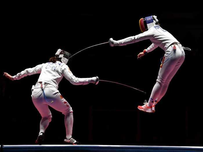 Fencers in action - fencers in flight.