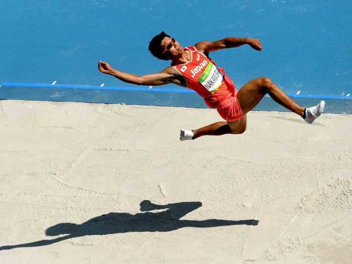 Japanese decathlete Akihiko Nakamura stretches out in the long jump.