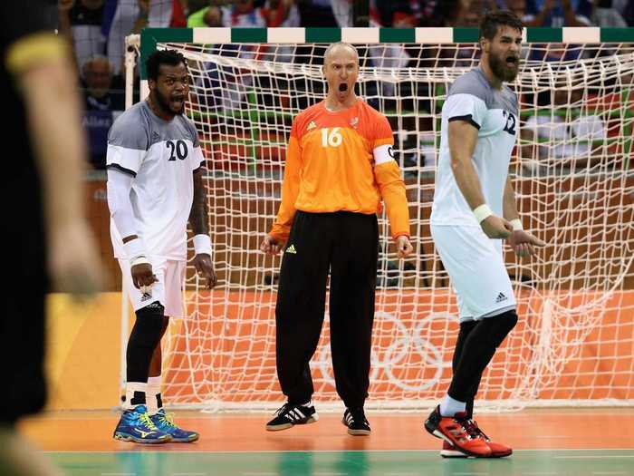 The French handball team roars during a semifinal match with Germany.