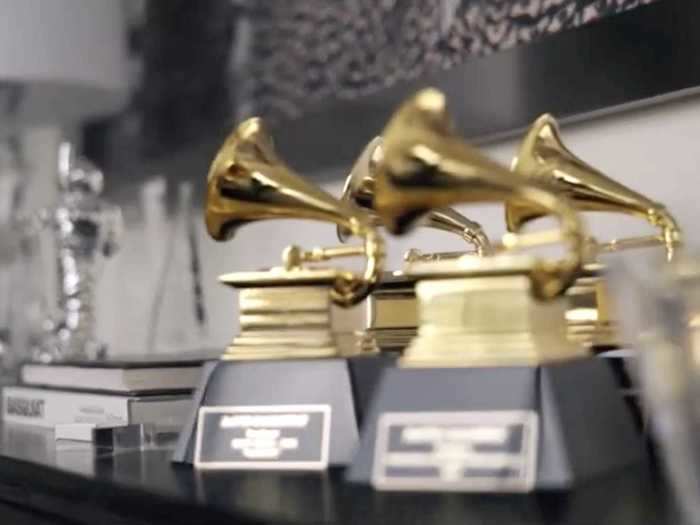 The Calloway home has a table that includes an MTV Video Music Awards moon-person statue and four Grammy awards.