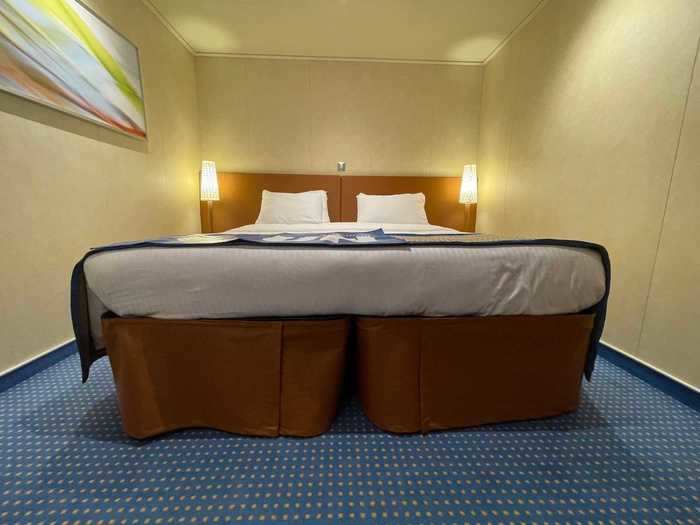 My stateroom attendant pushed my two twin beds together to create a king-size bed, an upgrade from my queen bed back home.