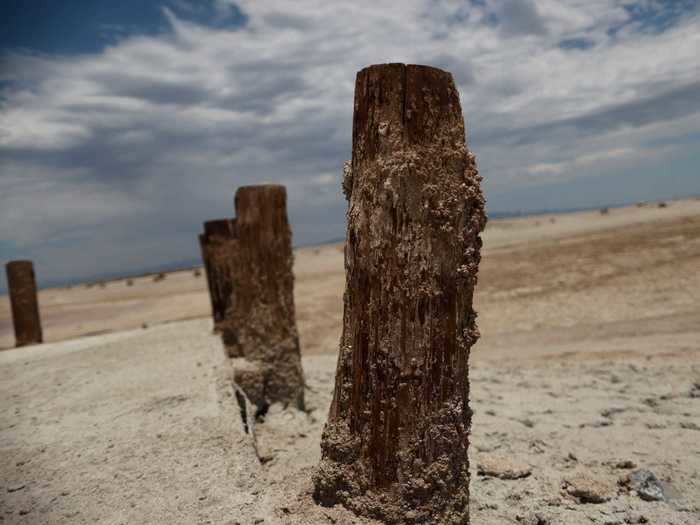 The dried up bodies of water are visible from space. Here, boat pillars that used to be submerged in the Salton Sea in Southern California are exposed by the receding water levels.