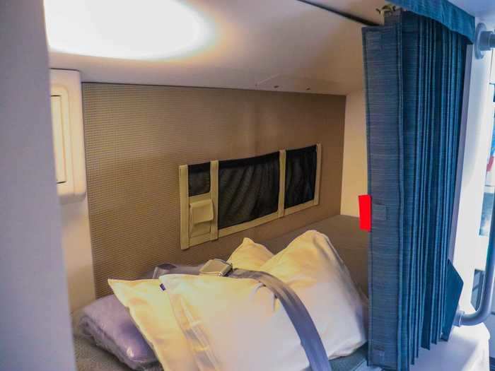 Each bunk has the essentials including a pillow, blanket, and mattress pad so flight attendants can get a good sleep.