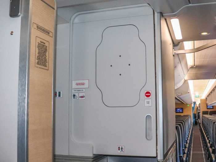 A door marked "crew only" with a red no entry symbol hides the compartment above.