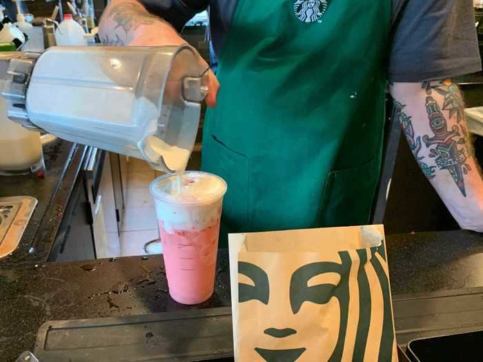 I got to watch the worker make my drink, which consists of a Strawberry Acai Refresher with coconut milk, topped with Vanilla Sweet Cream Cold Foam.