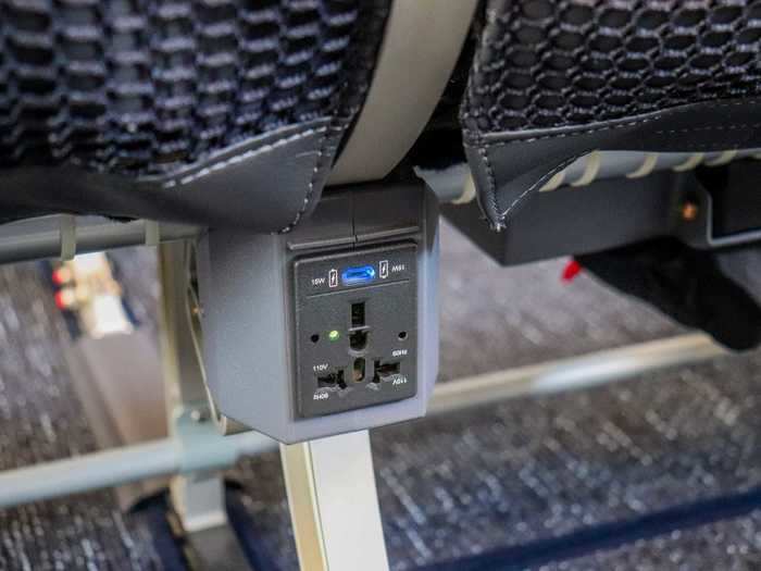 In-seat power in economy is available both through 110v AC power outlets and USB charging ports underneath the screens.