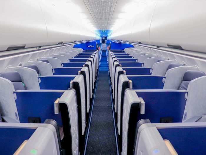 A total of 24 business class seats are angled towards the aisle in what