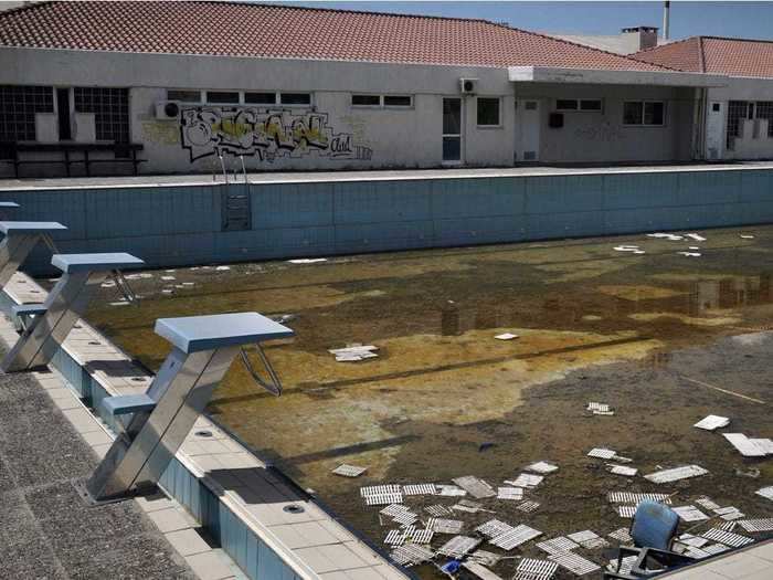 The pool is full of fetid water and starting to fall apart.