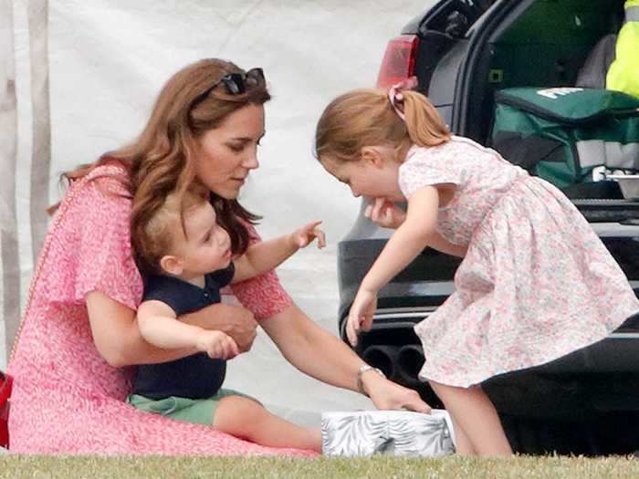 Middleton and Charlotte both wore pink, patterned dresses for a casual day in 2019.