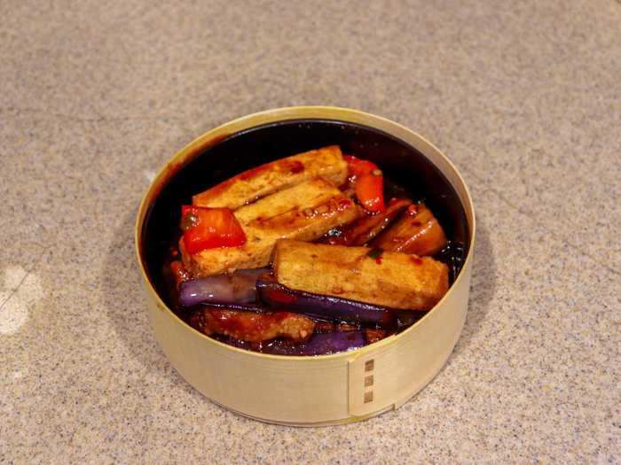 The other is the mapo eggplant tofu, a Chinese eggplant dish with eggplant, tofu, bell peppers, and scallion, coated in Sichuan peppercorn sauce.