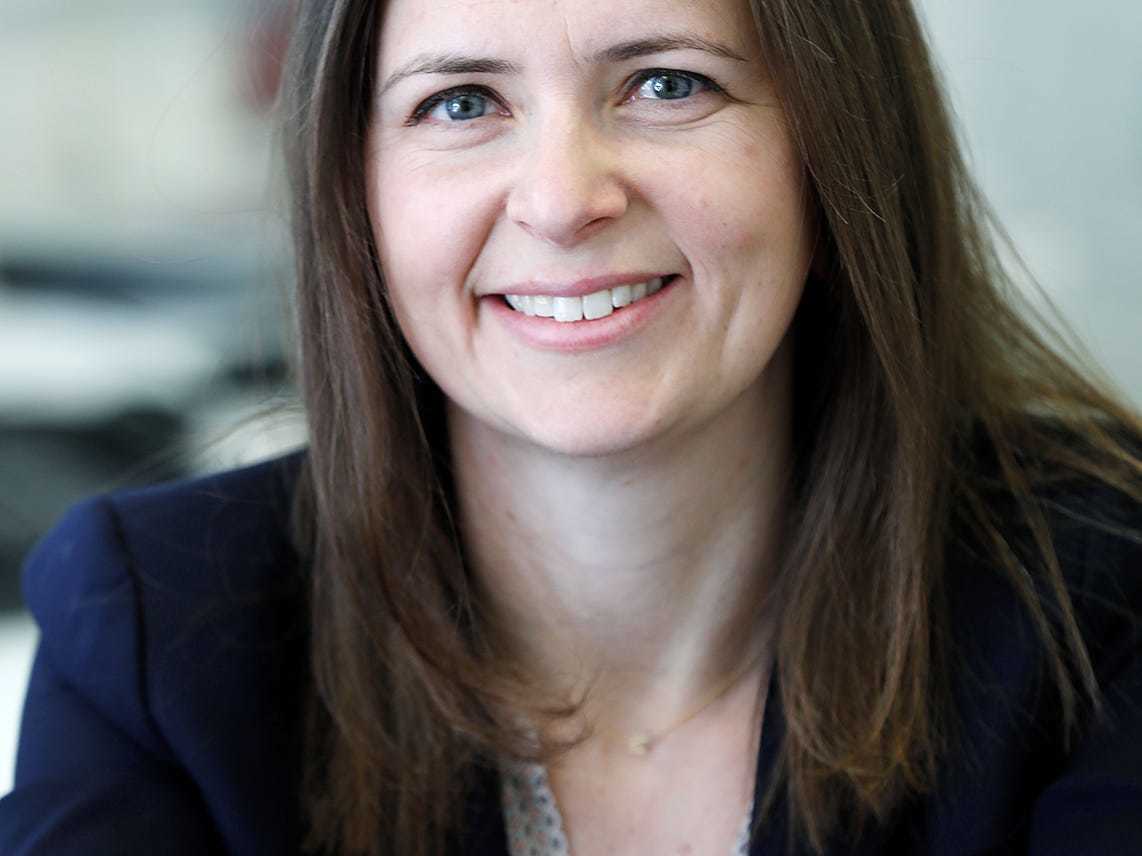 Headshot of Martha Smith, the CFO of Siemens USA, who is wearing a dark blazer over a light v-neck top.
