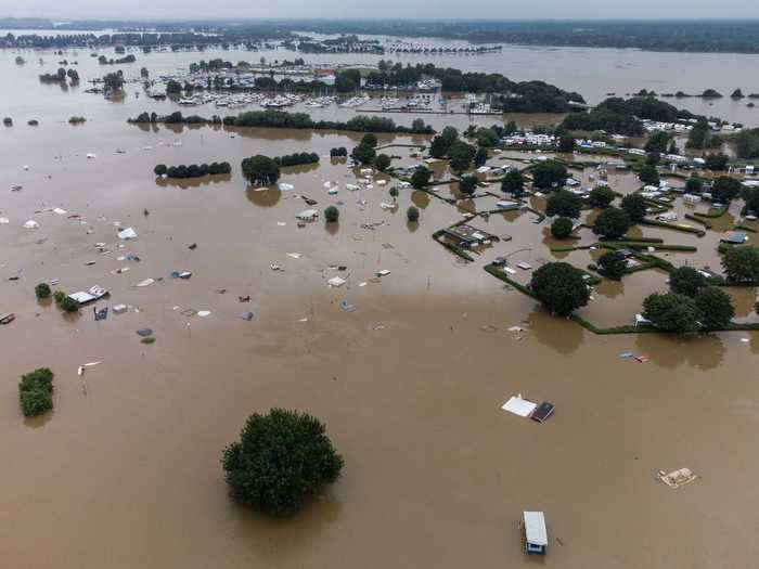 In Roermond, Netherlands, waters flooded a campsite, and aftermath photos make the area look almost like a lake.