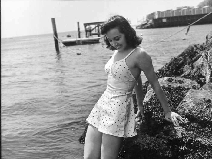 One-piece swimsuits started to look like little dresses in the 1940s.