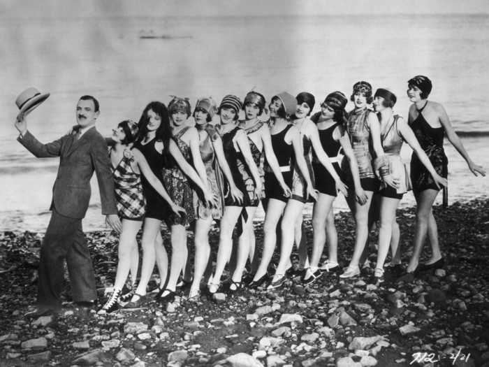 Around 1910, swimsuits became shorter and more form-fitting.