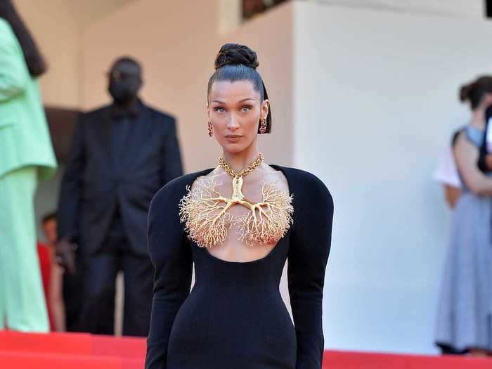 For the "Tre Piani" screening on Sunday, Hadid wore a lung-shaped necklace as a top.