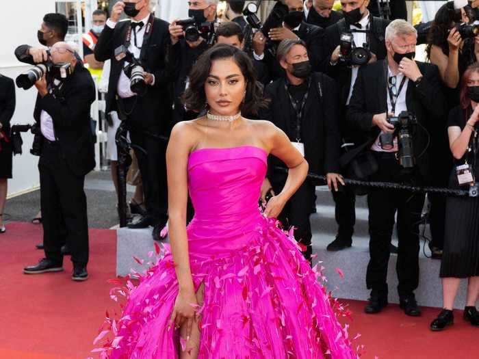 Influencer Fatima Almomen rocked a fuchsia ball gown with a leg-length slit for the event.