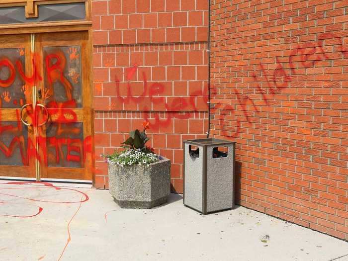 One church in Calgary, Canada had red handprints plastered all over their front walls alongside the words: "We were children."