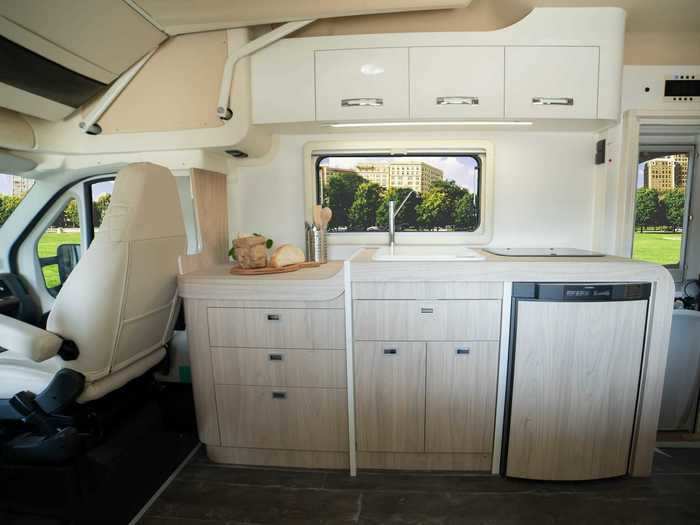 The kitchen and living room are towards the front of the van, while the bathroom and additional closet storage fall towards the back.