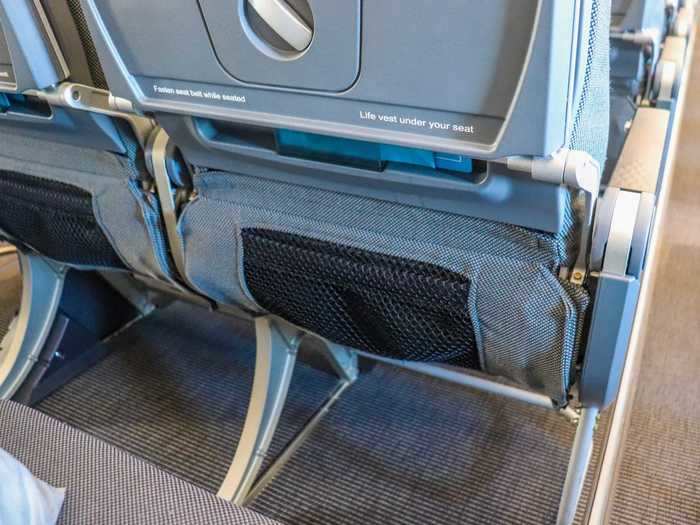 Large seat-back pockets are also available for small storage.