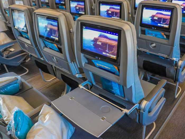 These seats also include a folding tray table, except that these fold horizontally.