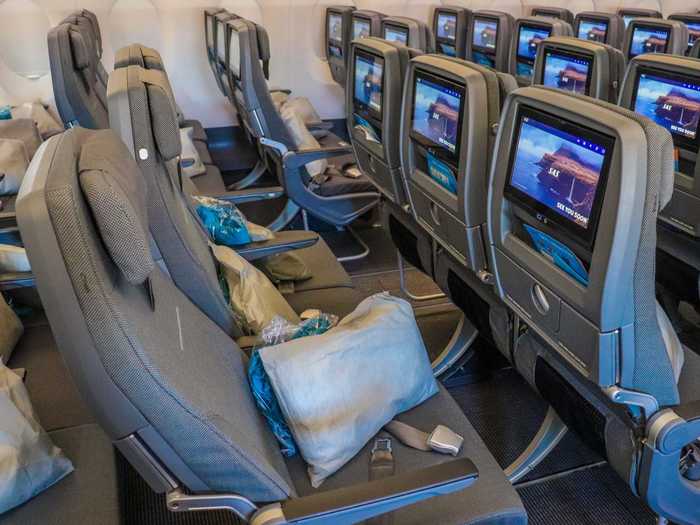 Seats in the cabin offer between 31 and 32 inches of pitch along with 17 inches of width. Pillow and blanket kits are also left on each seat.