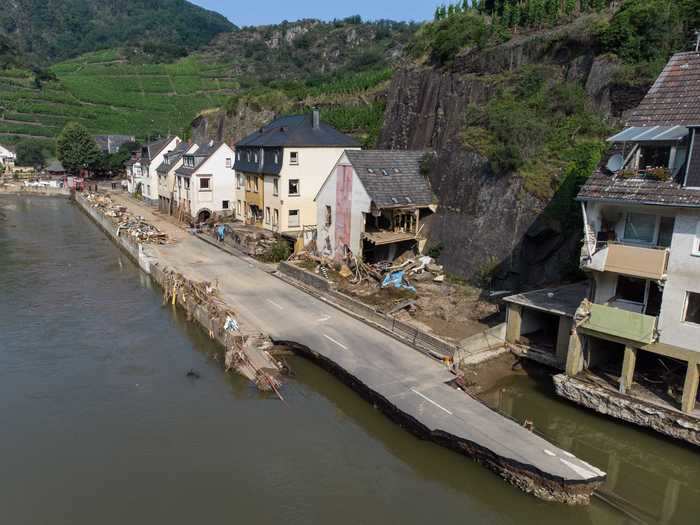 The flooding caused roadways to buckle, like one pictured here in the German state Rhineland-Palatinate.