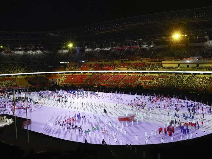 NOW: Tokyo 2020 - Athletes gather during the opening ceremony of the Tokyo 2020 Olympic Games.