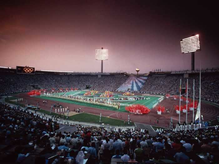 THEN: Moscow 1980 - Spectators take in the opening ceremony of the 1980 Summer Olympic Games in Russia.