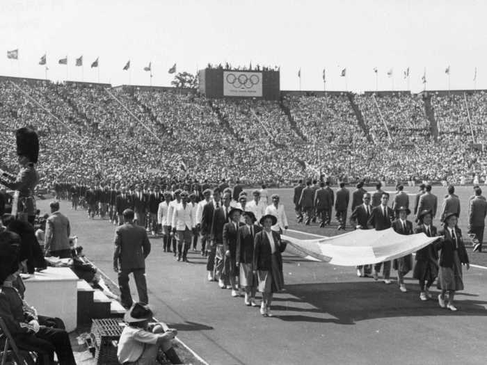 THEN: London 1948 - Athletes parade during the opening ceremony of the 1948 Olympic Games at Wembley Stadium.