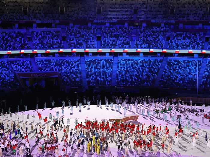 NOW: Tokyo 2020 - Team China walks through a fan-less Olympic Stadium at the opening ceremony in Japan.