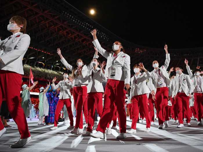 NOW: Tokyo 2020 - Members of Team Japan enter the empty Olympic Stadium during the opening ceremony of the Tokyo Olympic Games.