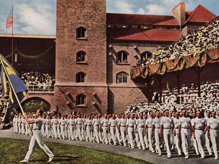 THEN: Stockholm 1912 - Swedish gymnasts enter the old stadium in Stockholm in the 1912 Olympic Games and march past the Swedish Royal family.