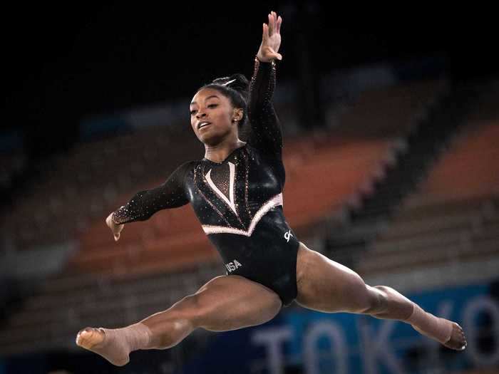 Most recently, Biles prepared for the Tokyo Olympics in a black-and-gold suit.