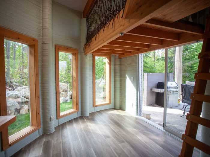 Moving along, the window-lined kitchen and living room are at the base of the ladder.