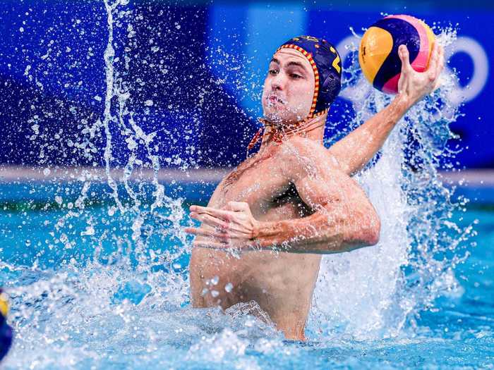 Alberto Munarriz of Spain breaches for a shot during water polo.