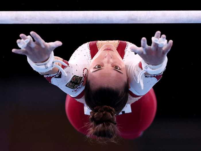 Pauline Schaefer-Betz of Team Germany demonstrates incredible concentration on the uneven bars.