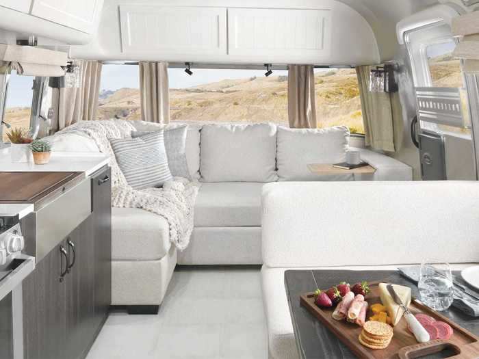 The two companies worked together on the design, which incorporates Pottery Barn hardware and furnishings into a trailer made by Airstream. Furniture includes a custom-made sofa inspired by Pottery Barn