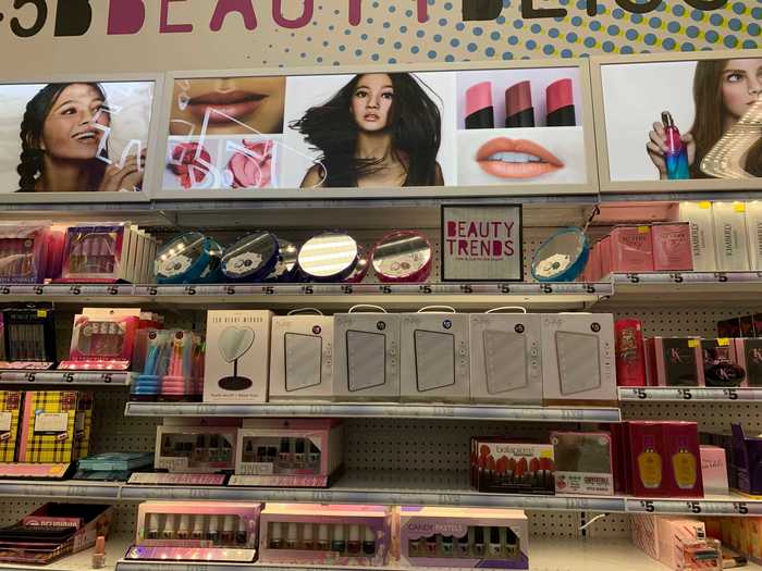 Inexpensive palettes and familiar drugstore makeup brands cover shelves on one side of the store.