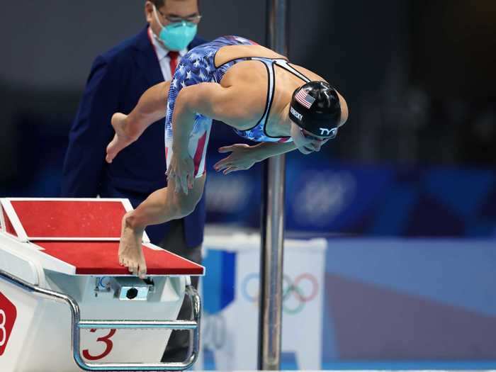 7/28: American Katie Ledecky dives off the block during the Women