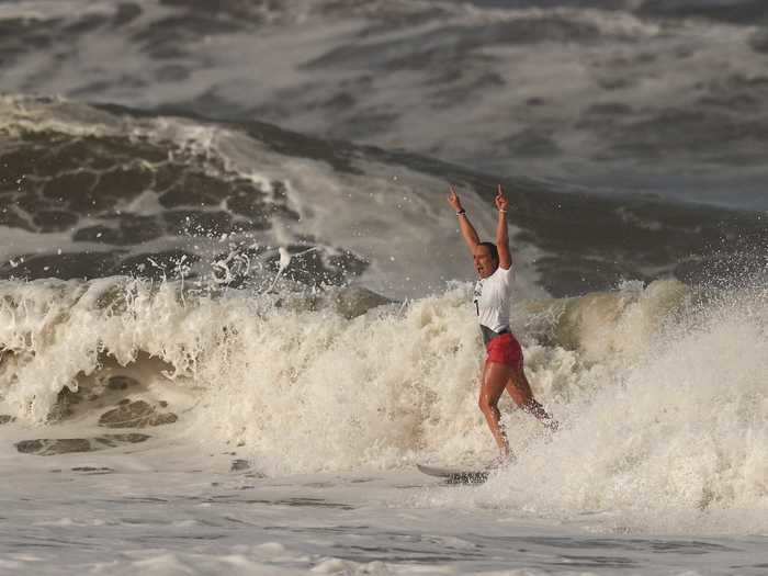 7/27: Carissa Moore of Team USA celebrates winning the gold in surfing.