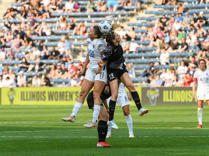 7/18: Sofia Huerta of OL Reign and Morgan Gautrat of the Chicago Red Stars battle for the ball in the air during a National Women