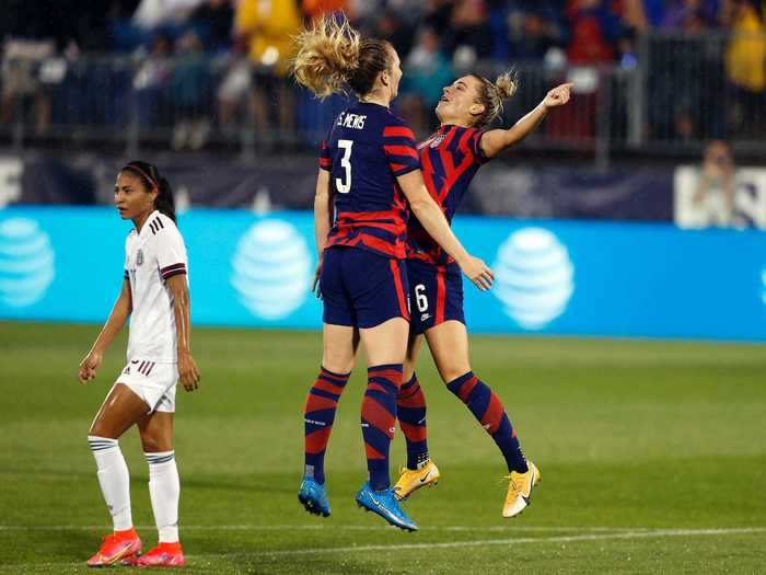 7/1: Sisters Sam and Kristie Mewis chest bump after collaborating for a US Women