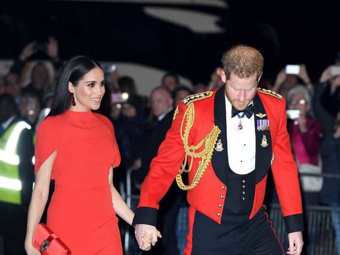 At the Mountbatten Festival of Music, Markle and Prince Harry both looked regal in red.