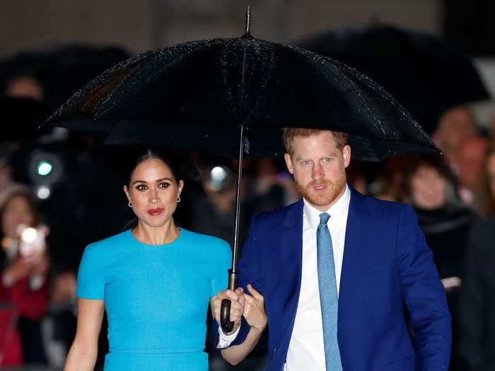 To kick off the first day of their final royal tour in 2021, Markle beamed in a turquoise dress.