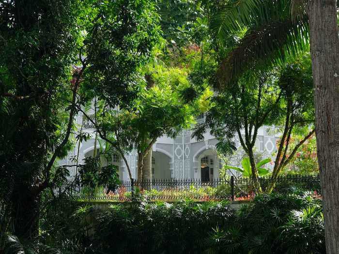 Through dense foliage, I could see just a peek of Eden Hall, the official residence of the British high commissioner in Singapore.