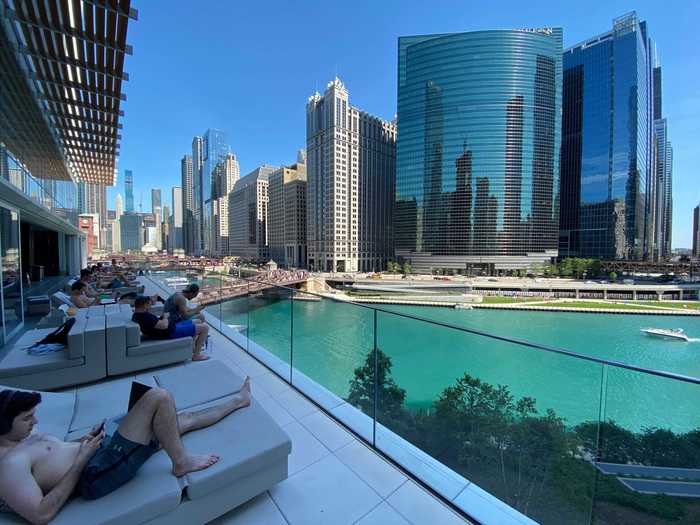 The sundeck was filled with people working on their laptops during the day.