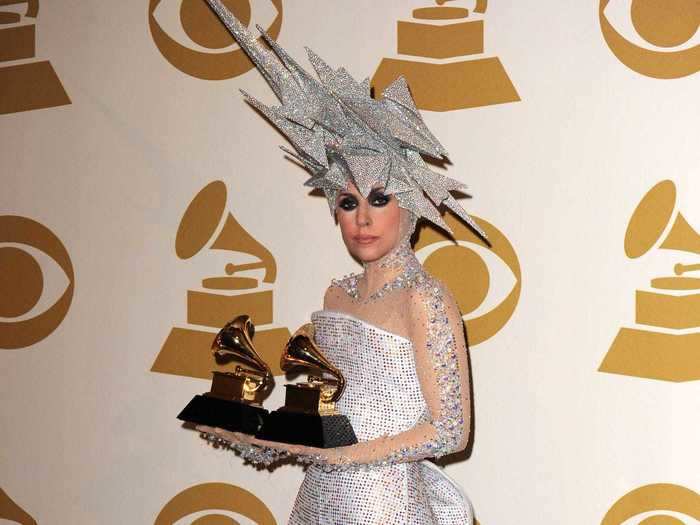 After the show, she posed with her two awards in the press room while wearing a sparkling minidress and standout headpiece.